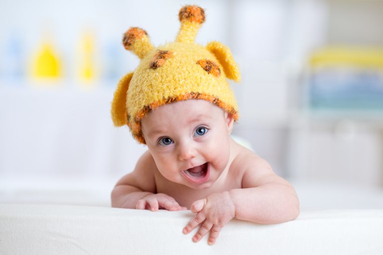happy baby or child in giraffe costume