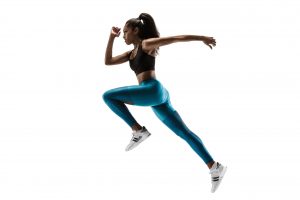 Young african woman running isolated on white studio background. One female runner or jogger. Silhouette of jogging athlete